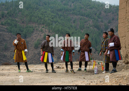 Bhutan, Paro, capital of Paro District aka Dzongkhag. Khuru (darts) traditional Bhutanese sport of throwing large darts outdoors. Players in tradition Stock Photo