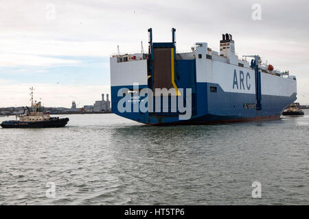 ARC car transporter vessel making her way out of Southampton on March 7 2017 en route to Baltimore attended by two tug boats Stock Photo