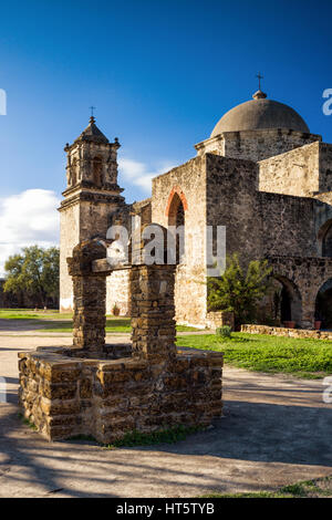San Jose Mission church exterior with water well in foreground, Texas Stock Photo