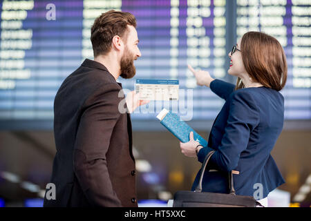 Business couple at the airport Stock Photo