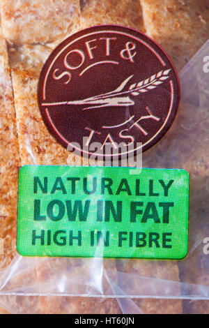 Soft & tasty naturally low in fat high in fibre - information on loaf of Tesco wholemeal medium sliced loaf of  bread Stock Photo