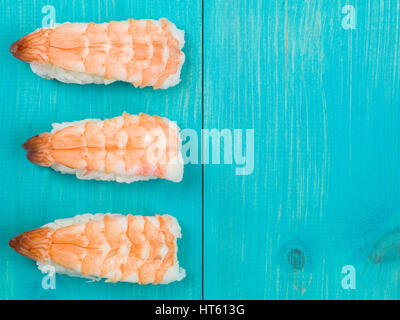 Three Pieces of King Prawn Japanese Style Sushi With Rice Stock Photo