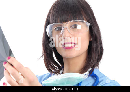 young female doctor with glasses looking at patients x-ray Stock Photo