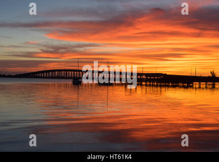 The Sunrise over the Eau Gallie Causeway Bridge from Melbourne to the Barrier Island and Beaches Stock Photo