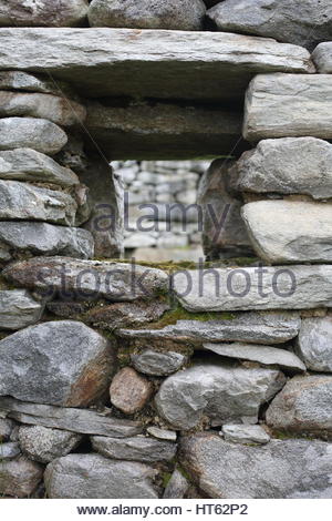 Stone window in the reains of a stone house in a deserted village on Achill Island, Mayo, Ireland Stock Photo