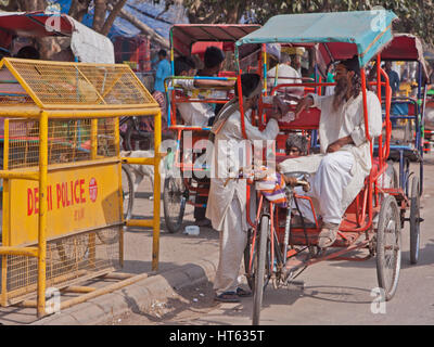 Owners of cycle rickshaws awaiting customers in the Chandni Chowk area of old Delhi, India Stock Photo