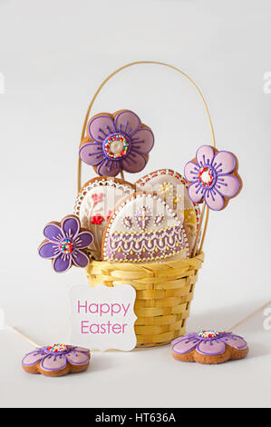 Wicker Basket With Tasty Easter Cookies On Kitchen Table Stock Photo 