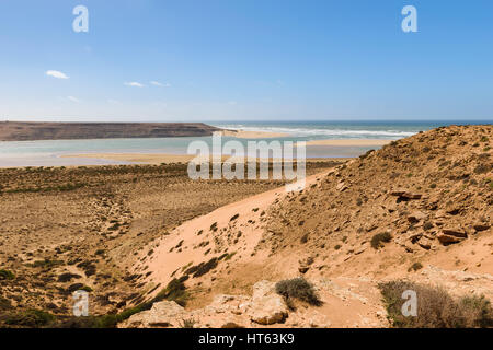 Image of the river mouth of Wadi Draa flowing in the Atlantic Ocean in Morocco. Stock Photo