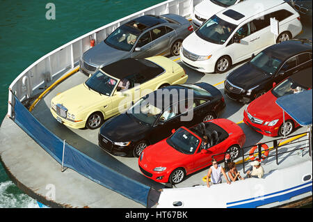 Miami USA - April 27, 2013: Ferry carry parked colorful cars view from top. Delivery car via ship Stock Photo