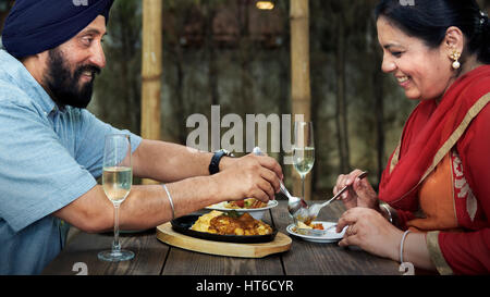 Indian Couple Dining Together Concept Stock Photo