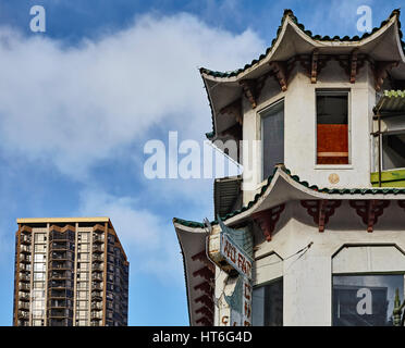 Honolulu; Hawaii; USA - August 6; 2016: Old Wo Fat building fronting a modern high rise building in the Chinatown Historic District Stock Photo