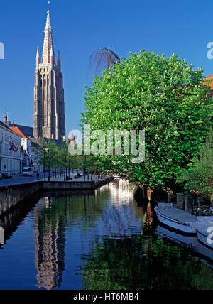Dijver Canal and Eglise Notre Dame in background, Bruges, Belgium Stock Photo