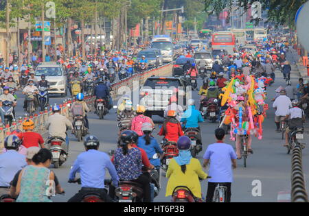 People commute in downtown Ho Chi Minh City Vietnam. Stock Photo