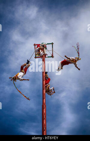 IXTAPA, MEXICO - DECEMBER 24, 2015: The Danza de los Voladores (Dance of the Flyers), or Palo Volador (pole flying), is an ancient Mesoamerican ceremo Stock Photo