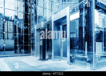 The exterior is a glass curtain wall elevator, blue tone chart. Stock Photo