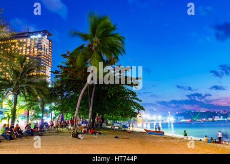 PATTAYA, THAILAND - JANUARY 27: This is city Pattaya beach at night with the Hilton hotel. Many tourists come to this part of the beach at night to si Stock Photo