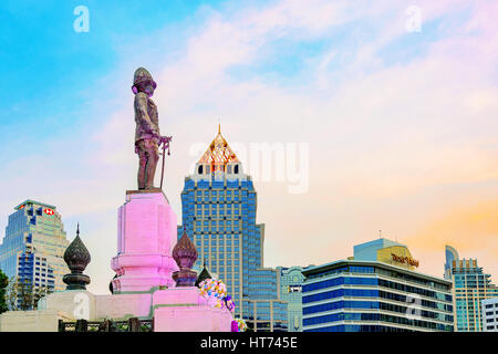 BANGKOK, THAILAND - JANUARY 29: King Rama VI statue with hotels and Silom financial district skyscrapers in the background in Bangkok on January 29, 2 Stock Photo