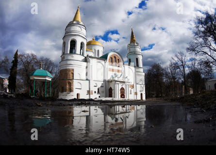 The Transfiguration Cathedral in Chernigiv with reflection, sunny spring day, cloudy sky, March, Ukraine Stock Photo