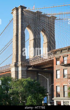 Brooklyn Bridge pillar in New York, warm light in a sunny day Stock Photo