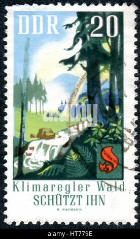 GERMANY - CIRCA 1969: A stamp printed in Germany (GDR), shows the forests as regulators of climate, circa 1969 Stock Photo