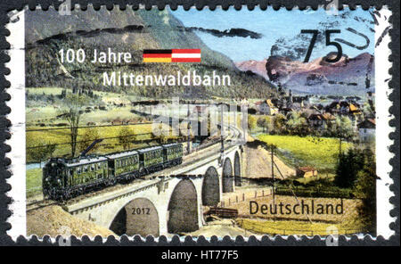 GERMANY - CIRCA 2012: A stamp printed in Germany, dedicated to the 100 year Mittenwald Railway, circa 2012 Stock Photo