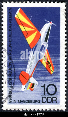 GERMANY - CIRCA 1968: A stamp printed in Germany (GDR), shows the sports airplane 'Trener', circa 1968 Stock Photo