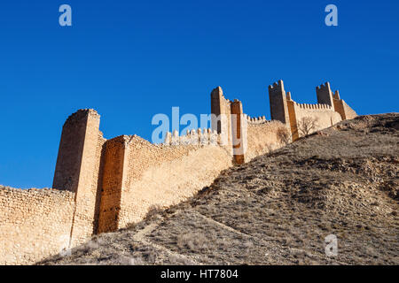 Hill with old city wall and towers under a blue sky. Albarracin, Teruel, Spain. Stock Photo