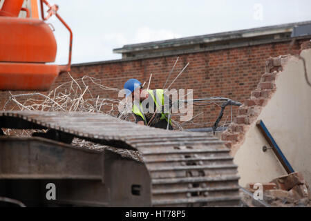 Demolition Sorting Demolition worker sorting copper pipe from debris Stock Photo - Alamy