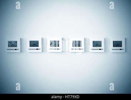 digital thermostat on white wall Stock Photo