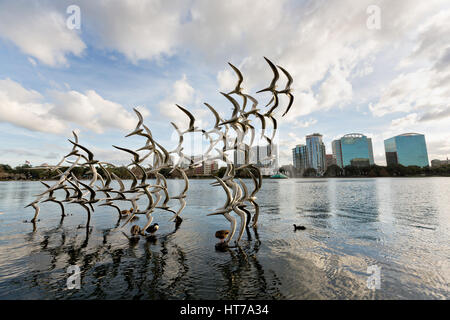 Sculpture Take Flight by artist Douwe Blumberg on Lake Eola in Orlando, Florida. Lake Eola Park is located in the heart of Downtown Orlando and home to the Walt Disney Amphitheater. Stock Photo