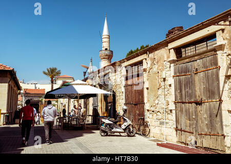 LIMASSOL, CYPRUS - APRIL 01, 2016: People walking on narrow street in old part of Limassol. Stock Photo