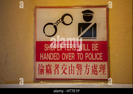 18.01.2017, Singapore, Republic of Singapore, Asia - A deterring warning sign is seen at a shop in Singapore's Chinatown district. Stock Photo