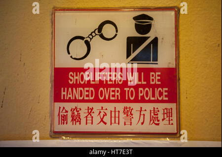 18.01.2017, Singapore, Republic of Singapore, Asia - A deterring warning sign is seen at a shop in Singapore's Chinatown district. Stock Photo