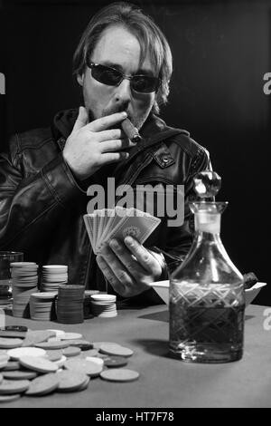 photo-of-a-man-playing-poker-while-weari