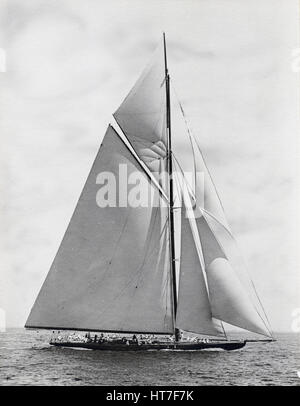 Antique c1900 photograph, unknown yacht belonging to Charles Oliver Iselin. Iselin (1854-1932) was an American banker and yachtsman. He participated in and won six consecutive America’s Cup races in 1887, 1893, 1895, 1899, 1901 and 1903. He owned yachts 'Defender,' 'Reliance,' 'Columbia' and others. Photograph by Winslow of Providence, Rhode Island. SOURCE: ORIGINAL SILVER GELATIN PRINT. Stock Photo