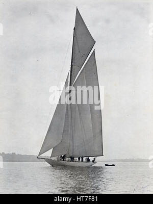 Antique c1900 photograph, unknown yacht belonging to Charles Oliver Iselin. Iselin (1854-1932) was an American banker and yachtsman. He participated in and won six consecutive America’s Cup races in 1887, 1893, 1895, 1899, 1901 and 1903. He owned yachts 'Defender,' 'Reliance,' 'Columbia' and others. Photograph by Winslow of Providence, Rhode Island. SOURCE: ORIGINAL SILVER GELATIN PRINT. Stock Photo