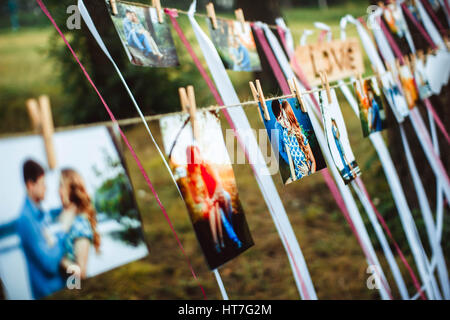 photos of lovers hanging on a rope outdoors Stock Photo