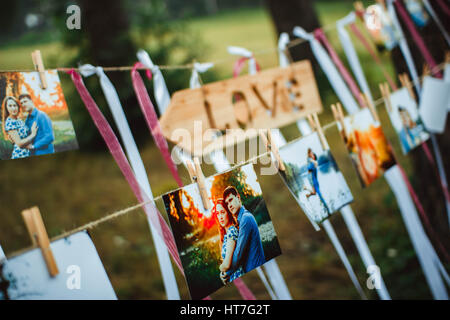 photos of lovers hanging on a rope outdoors Stock Photo