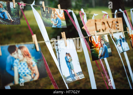 photos of lovers hanging on a rope outdoors Stock Photo