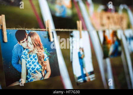 photos of lovers hanging on a rope outdoors Stock Photo