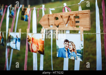 photos of lovers hanging on a rope outdoors Stock Photo