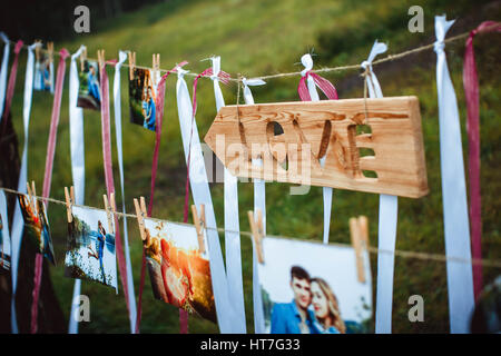 photos of lovers hanging on a rope outdoors Stock Photo