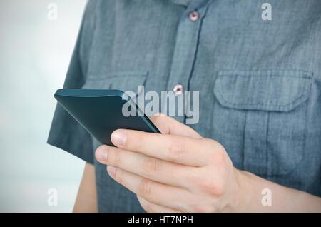 Man using smartphone. Close up of unrecognizable person Stock Photo