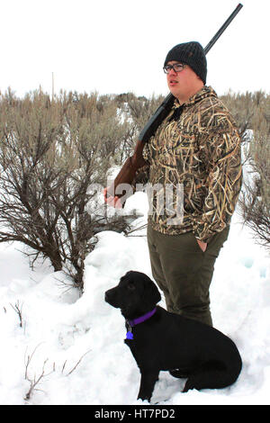 Hunter and black lab dog Stock Photo