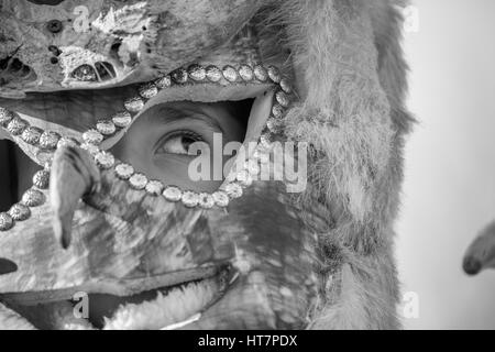 PERNIK, BULGARIA - JANUARY 27, 2017: Masked teen participant is looking away at Surva, the International Festival of the Masquerade Games Stock Photo