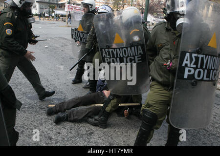 Athens, Greece. 8th Mar, 2017. Riot police clashes with protesting farmers outside the greek Agriculture Ministry. Police fired tear gas to prevent farmers from forcing their way into the ministry building, while protesters responded by throwing stones. No injuries or arrests were reported. Protesters are angry at increases in their tax and social security contributions, part of the income and spending cuts Greece's left-led government has implemented to meet bailout creditor-demanded budget targets Credit: Aristidis Vafeiadakis/ZUMA Wire/Alamy Live News Stock Photo