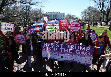 Washington, USA. 8th Mar, 2017. Hundreds of people attend a protest and march against U.S. President Donald Trump's global gag rule in Washington, DC, the United States, on March 8, 2017. In January, Trump signed an executive order -- the global gag rule, banning funding for American non-governmental organizations which support abortion initiatives worldwide. Credit: Yin Bogu/Xinhua/Alamy Live News Stock Photo