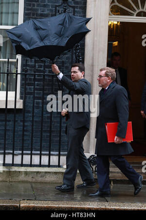 London, UK. 8th March 2017. James Brokenshire (Secretary of state for Northern Ireland) struggles with an umbrella as he leaves Number 10 Downing Street after cabinet meeting on Budget Day, Downing Street, London, Great Britain, 08 March, 2017. Credit: Paul Marriott/Alamy Live News Stock Photo