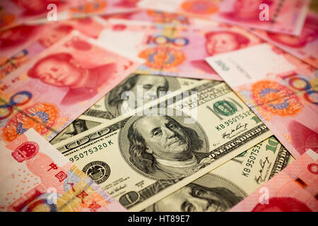 Chinese Yuan Note and U.S. dollar background  (Exchange rate concept) Stock Photo