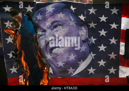 Manila, Philippines. 08th Mar, 2017. A mock US flag with Trump's face was burned by the protesters near the US embassy. Women rights group Gabriela, lead a march to the U.S. embassy in Manila, noon Wednesday in observation of International Women's Day. Credit: J Gerard Seguia/Pacific Press/Alamy Live News Stock Photo